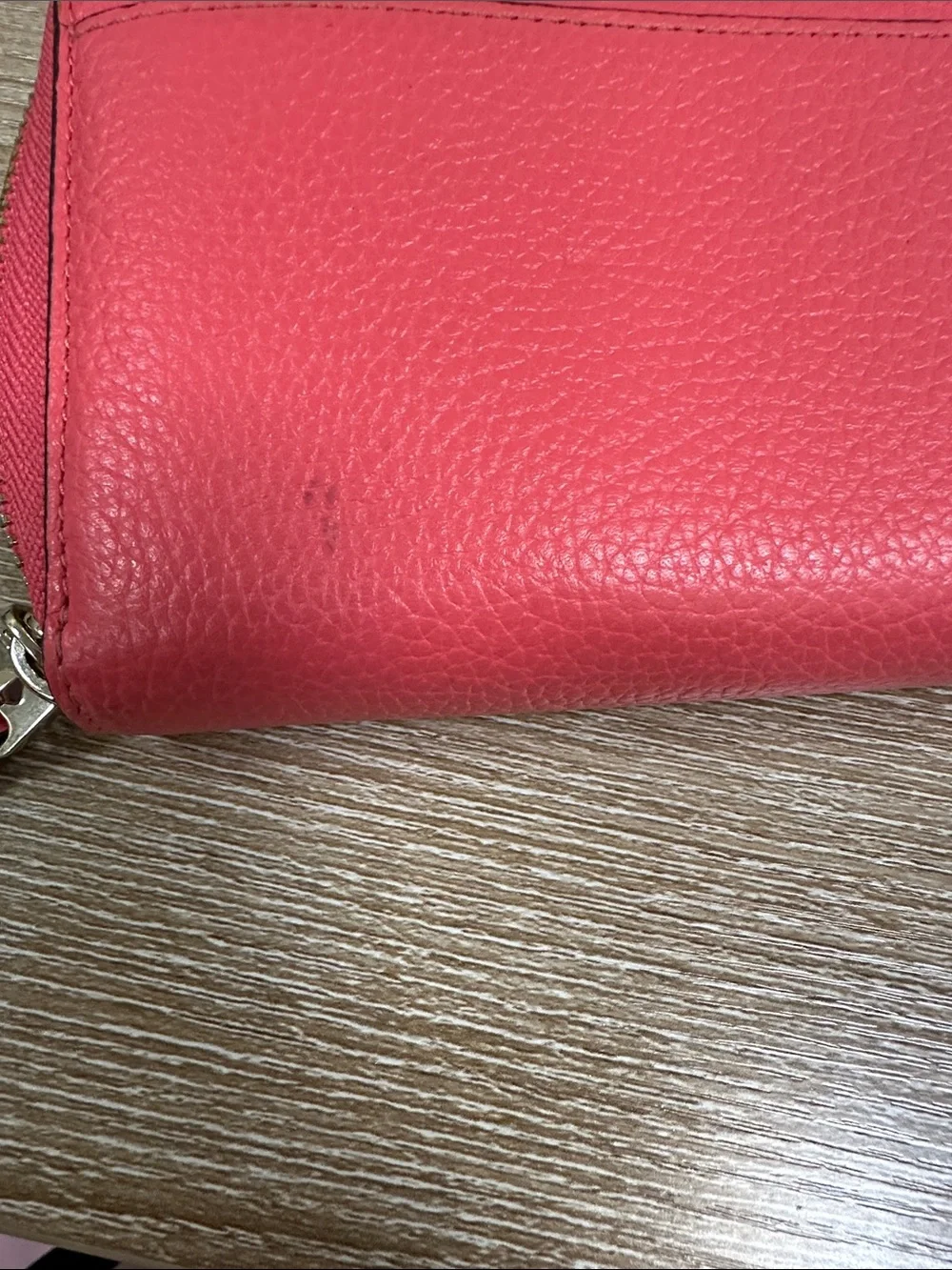 kate spade coral pink zip-around pebble leather wallet with wrist strap